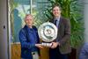 National Sheep Association CEO Phil Stocker MBE (L) receiving the Royal Smithfield Club Bicentenary Trophy from Club Secretary Richard Saunders