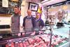 Oliver and Anthony Kitson with Martin Calvert in the Northallerton butchers shop with the three winter Fair trophies.