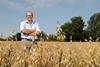 NFU president Tom Bradshaw standing in a wheat field.