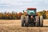 Red tractor in field