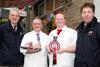 John Summers, second from left, and his butcher son Jack are pictured outside their Clayton shop with choice cuts of their championship-winning Christmas pork, joined by Skipton Auction Mart’s general manager Jeremy Eaton, left, and livestock sales m…