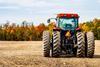 red tractor in field unsplash Copy