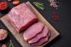 Raw pork on chopping board