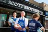 Scott Jarron owner of Scott Brothers butchers pictured with Team Scotland players Connor Henderson (left) and James Maich. Picture by Graeme Hart. Copyright: Perthshire Picture Agency.