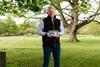 Rick Buckle, managing director Farms - Pork Division at Cranswick Plc. He stands in a field, a tree visible in the background, and he holds a packet of pork from Lidl.