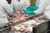 Workers at chicken processing factory.