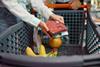 Shopper buying meat in a supermarket