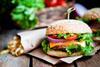 Closeup of home made burgers on wooden background