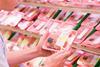 Man choosing meat at the supermarket