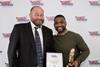 Andrew Rook of J.C. Rook & Sons receiving the award for Best British Banger from British Sausage Week ambassador JB Gill.