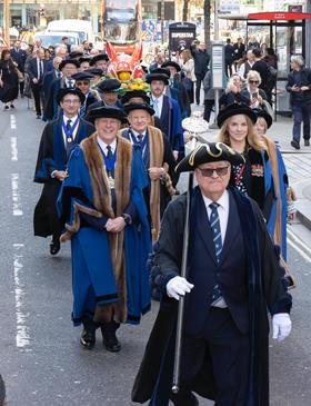 Procession for Boar's Head ceremony.