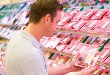 Man choosing meat at the supermarket