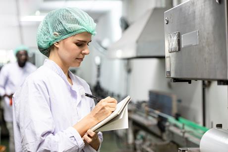 Woman holding clipboard