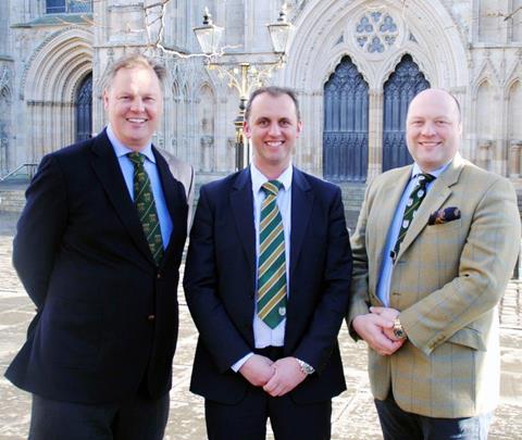 Alnwick butcher Mark Turnbull, centre, newly appointed chairman of the national Butchers Q Guild, is congratulated by outgoing chairman Brindon Addy, joined by new national vice-chairman David Lishman.