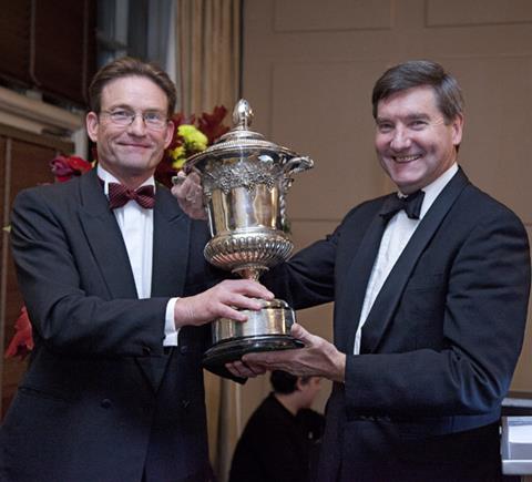 Peter Bradnock (right) is to retire after 20 years in the poultry industry. He is pictured here receiving his poultryman of the year award from BPC chairman, John Reed.