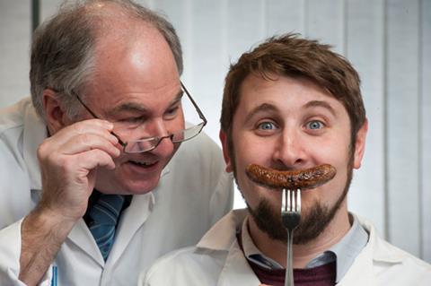 Sausages to smile about! Douglas Scott, Chief Executive of the Scottish Federation of Meat Traders Association (left), pictured with Jack Broussine of Quality Meat Scotland, and one of the top quality entries.