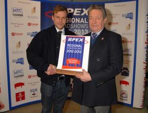 Charlie Shaw is awarded his title by BPEX's Keith Fisher.