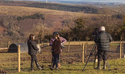 A film crew from S4C at Puff Pigs farm near Mountain Ash discussing Porc from Wales Week 