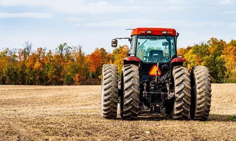 red tractor in field unsplash Copy 