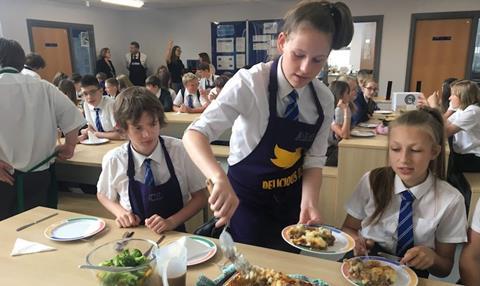 Y8 Pupils serve their cottage pie to the rest of the year group. Nigel Winn from Owen Taylors chatting to Headteacher dr Hobbs in background  1