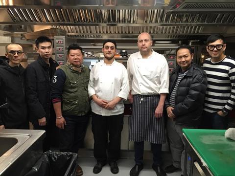 The group pictured with chef Adam Hilliard. 