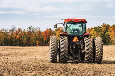 Red tractor in field