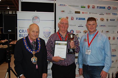 Mike Maloney (centre) with (left) NFMFT President Jim Sperring and Michael Rawsthorne of IFI Ingredients (sponsors)