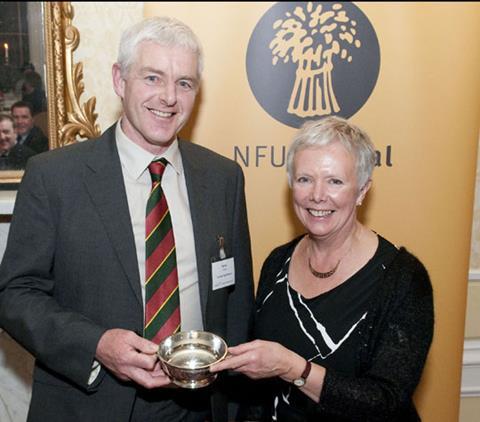 Sandy Howie of Scottish Pig Producers receiving the Ed Rainy Brown Memorial Award from Katy Rainy Brown at the SAOS annual conference.