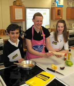 Fiona is joined by Kemnay Academy pupils Matthew Cassidy and Amy Stewart after the cookery demonstration.