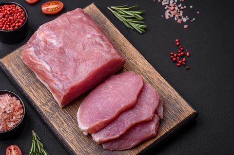 Raw pork on chopping board