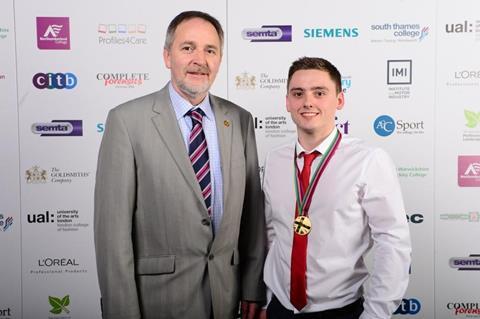Matthew Edwards with Cambrian Training Company’s managing director Arwyn Watkins after receiving his gold medal.