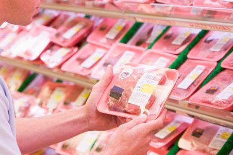 Man choosing meat at the supermarket