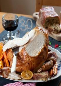 Roasted Turkey Crown with Parma Ham Sausage Almond and Fig Loaf Roman Gravy.© Copyright Michael Powell.